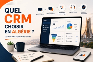 Dirigeant de PME algérienne comparant des solutions CRM sur ordinateur portable